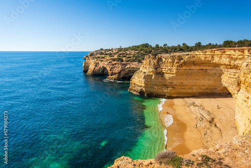 Beautiful cliffs and beach called Cao Raivoso in Algarve, Portugal © eunikas
