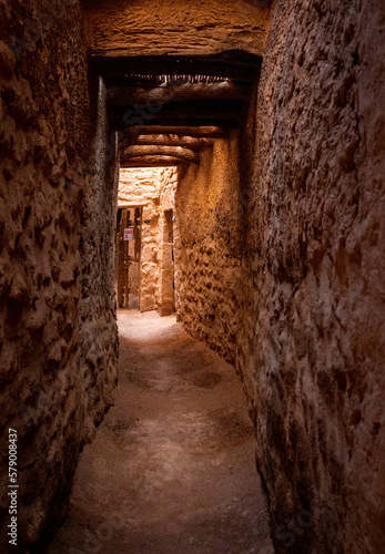 Fototapeta Naklejka Na Ścianę i Meble -  The alleys of the restored Alula's old town, 900 years old historical village in Medina, Saudi Arabia.	