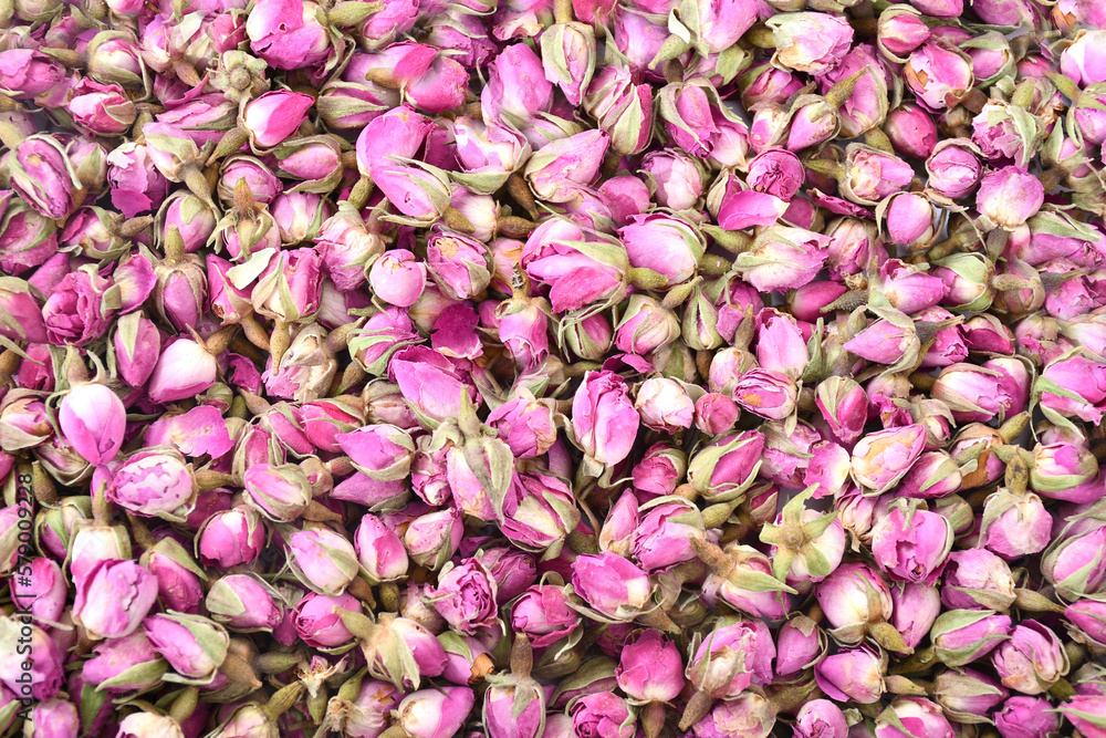 Rose buds background texture. Floral background. Naturally dried rose buds.