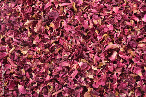 Dried rose petals background texture.
