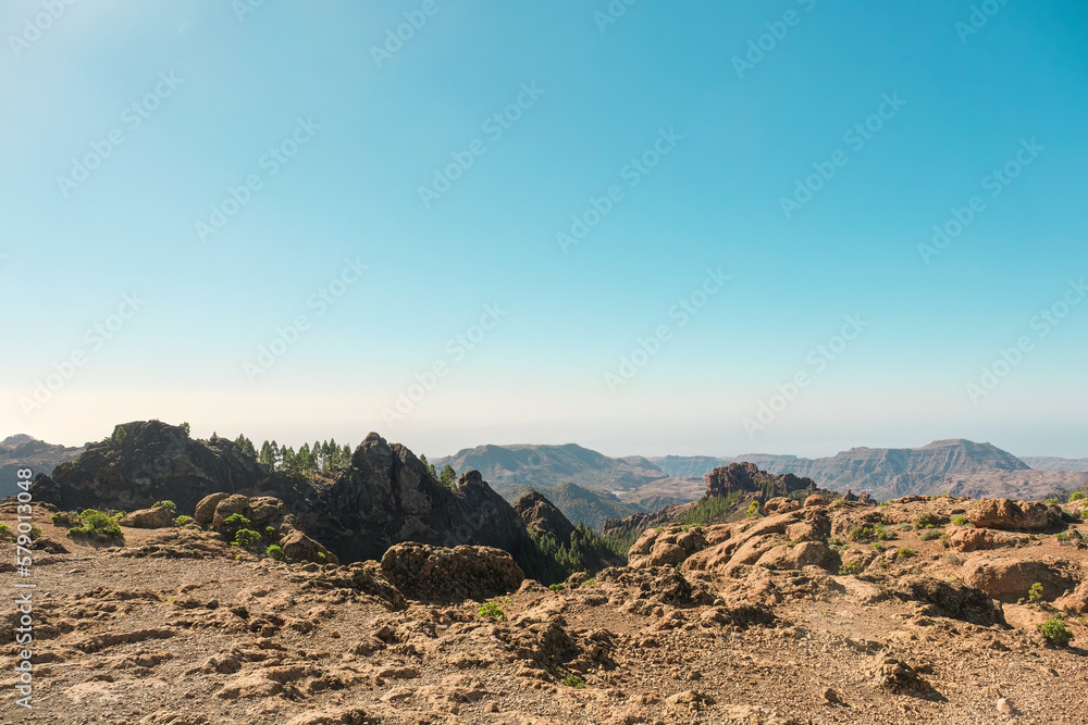 Wild volcanic landscape landmark with pine trees, cliffs and rock formations in Pico de las Nieves, Tejeda, Gran Canaria. Sunny and clear day
