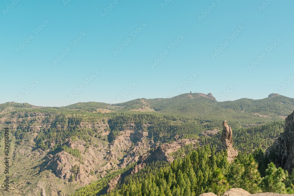 Wild volcanic landscape view point with pine trees, cliffs and rock formations in Pico de las Nieves, Tejeda, Gran Canaria. Sunny and clear day
