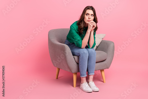 Full length photo of stressed thoughtful lady dressed green blouse looking empty space isolated pink color background