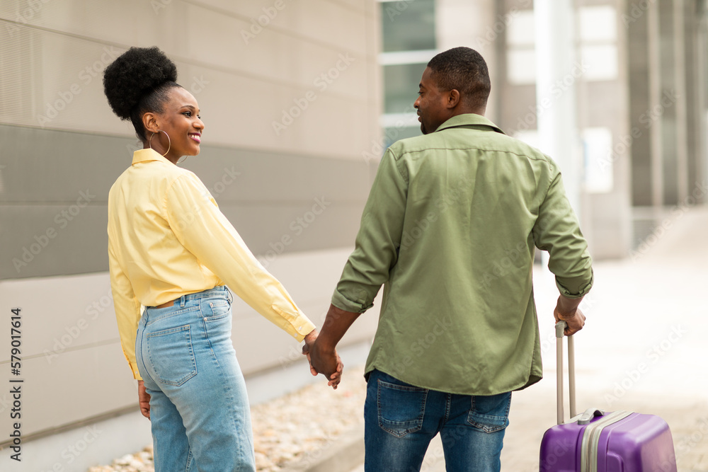 African American Spouses Traveling Walking With Suitcase At Airport Outdoors African American Spouses Traveling Walking With Suitcase At Airport Outdoors