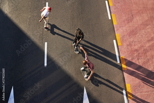 The best memories come from the craziest ideas. a group of skaters skating in the city.