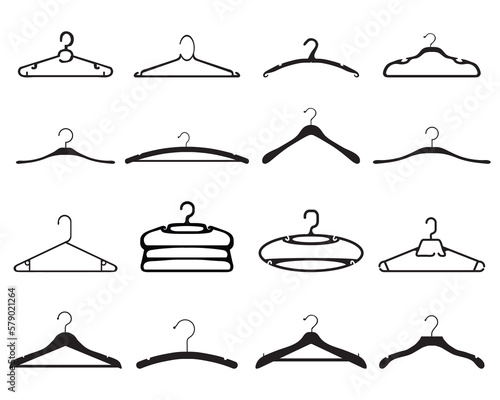 Black silhouettes of clothes hangers on white background