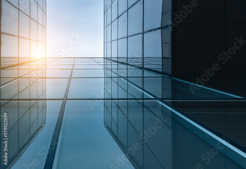 Sunset reflected off modern glass facades of skyscrapers in the financial center of the city