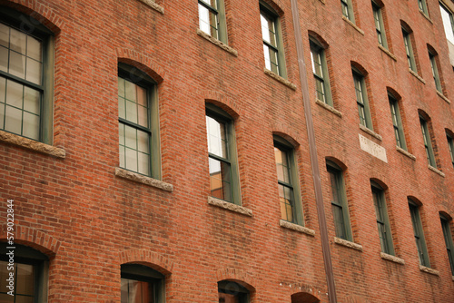 Old brick building apartment and office building in providence rhode island that shows industrial aged factory and architecture with windows 