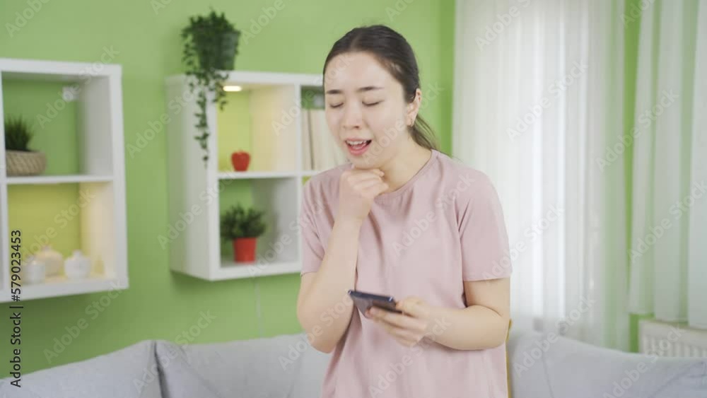 Asian young woman coughing violently and for a long time.
Young asian woman with COPD or asthma coughing, breathing hard.
Asian young woman coughing violently and for a long time.
Young asian woman with COPD or asthma coughing, breathing hard.
