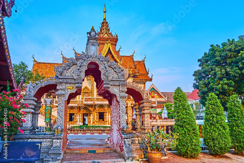The sculptured gate and topiary garden of Wat Buppharam, Chiang Mai, Thailand photo