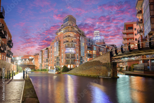 Sunset and brick buildings alongside a water canal in the central Birmingham, England
