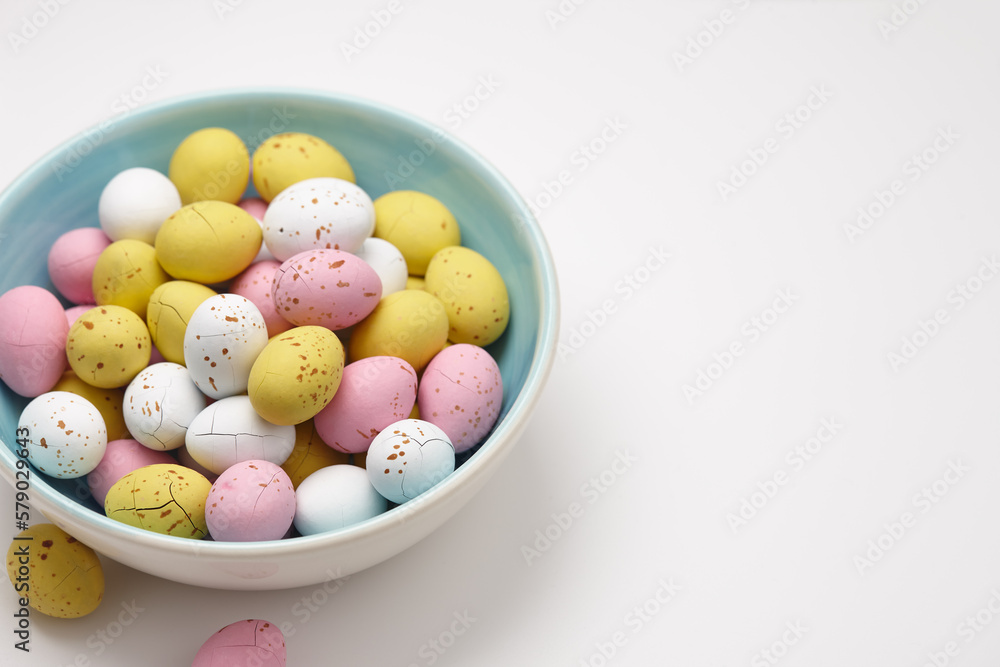 Colorful glazed chocolate candies in plate on white background Colorful glazed chocolate candies in plate on white background