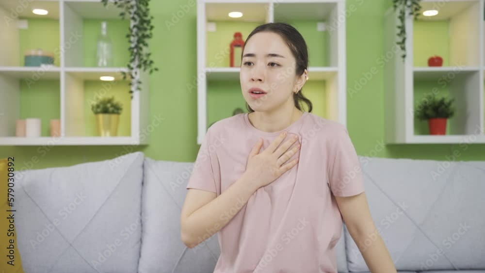 Young Asian woman with COPD has long-term shortness of breath, can't breathe. Young Asian woman with COPD has long-term shortness of breath, can't breathe.