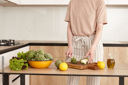 Woman in the kitchen preparing to cook