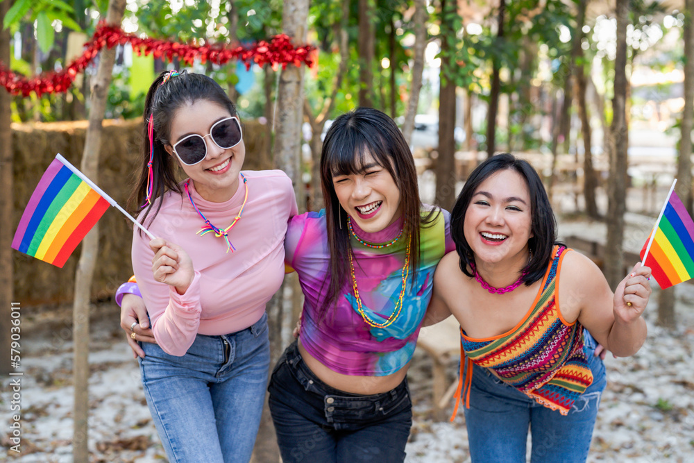 Group of friends LGBTQ having fun together happy Thai transgender Asian woman LGBTQIA at music festival LGBT