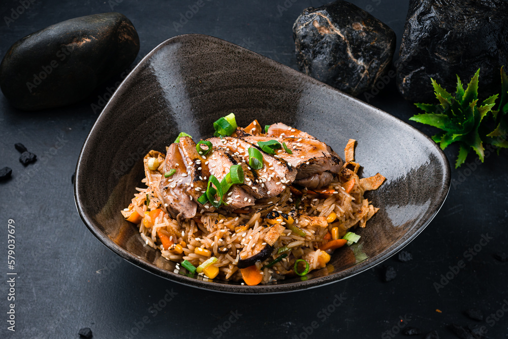 Rice with duck pieces, scrambled eggs, shiitake mushrooms and vegetables. Rice with duck pieces, scrambled eggs, shiitake mushrooms and vegetables.
