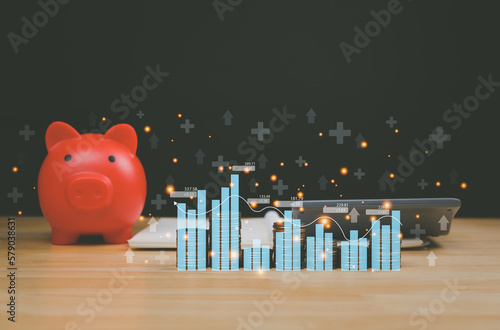 Concept businessman calculating Interest Rates and Dividends Graph showing higher income and profit percentage - stocks, gold funds, savings, stack of coins, percentage - successful business data
