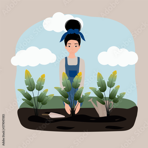 The girl is planting plants in the flowerbed. A woman plants flower pots