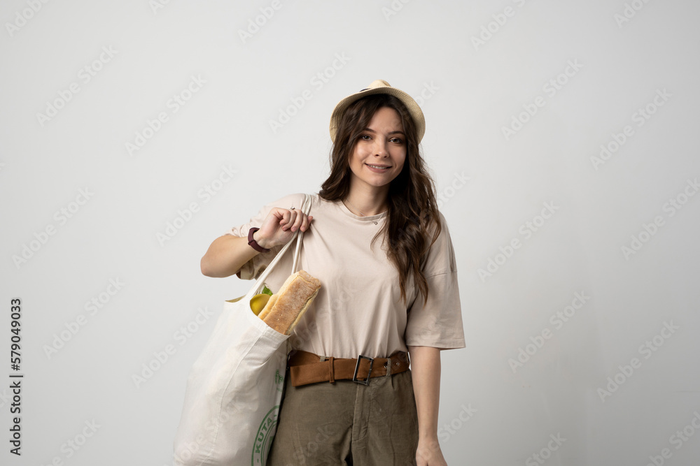 Zero waste concept. Woman holding reusable cotton shopping bag with groceries. Plastic free. Eco friendly concept. Sustainable lifestyle. Zero waste concept. Woman holding reusable cotton shopping bag with groceries. Plastic free. Eco friendly concept. Sustainable lifestyle.