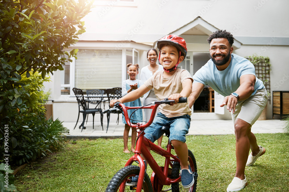 Foto De Learning Bicycle And Proud Dad Teaching His Young Son To Ride can-you-have-a-passenger-on-motorcycle-reviewmotors-co