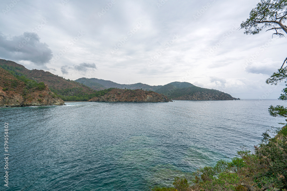 the scenic route of lycian trail, between Tekirova and Çıralı is full of amazing bays and beaches with forest and mountains.