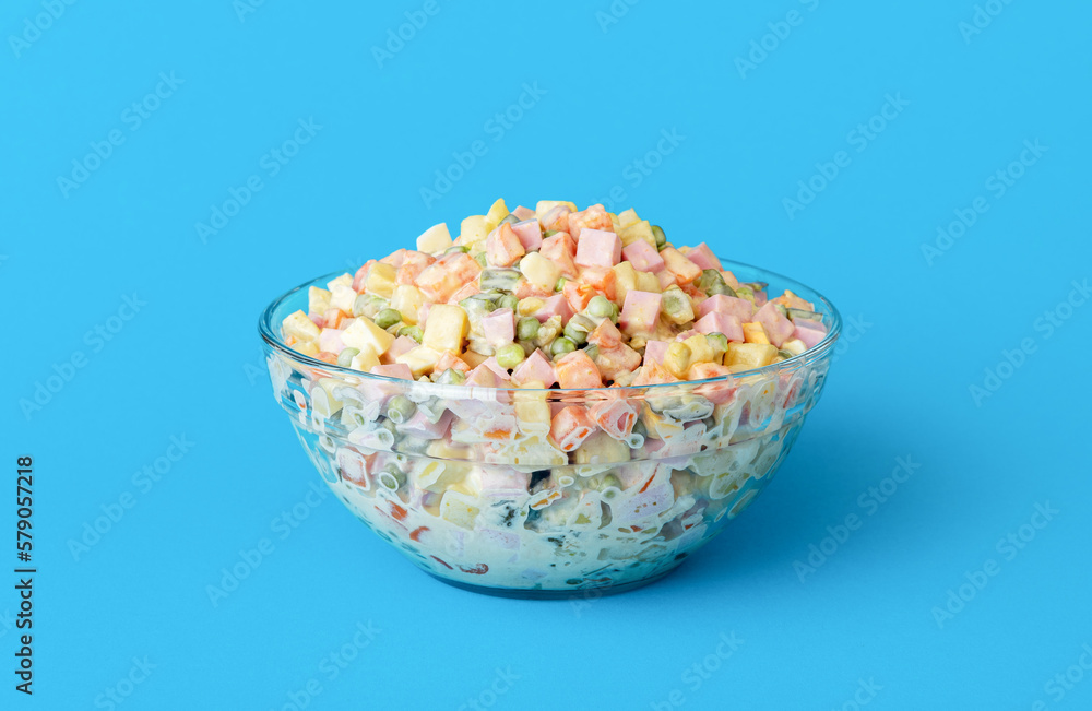Mayonnaise salad bowl isolated on a blue background Mayonnaise salad bowl isolated on a blue background