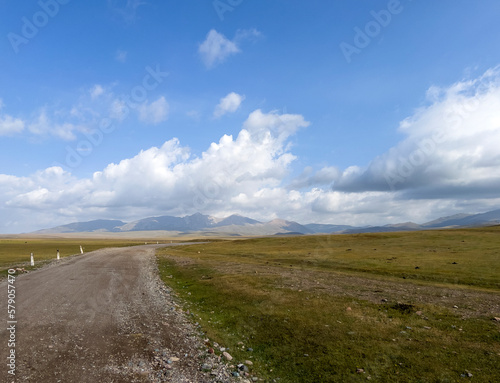 A gravel road in the middle of beautiful countryside.