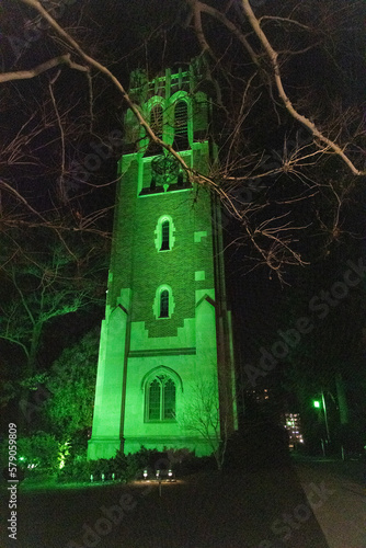 Beaumont Tower at night lit in green on the campus of Michigan State University in East Lansing, Michigan. photo