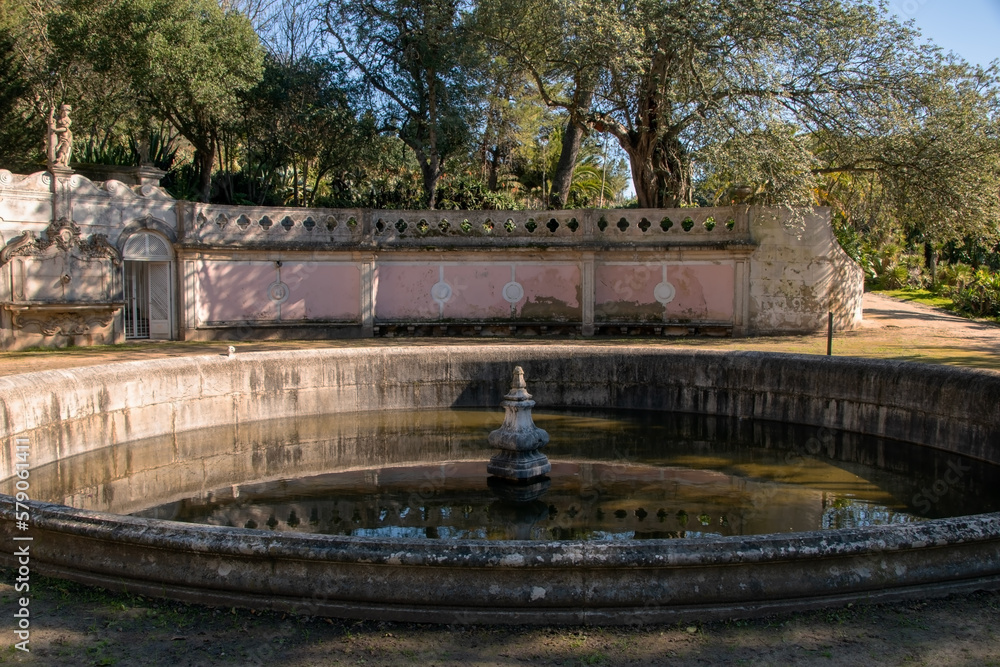 Artificial round pond fountain in Lisbon garden