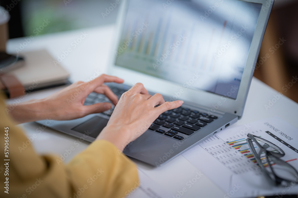 Happy businesswoman talking on mobile phone while analyzing weekly schedule in the office. Happy businesswoman talking on mobile phone while analyzing weekly schedule in the office.