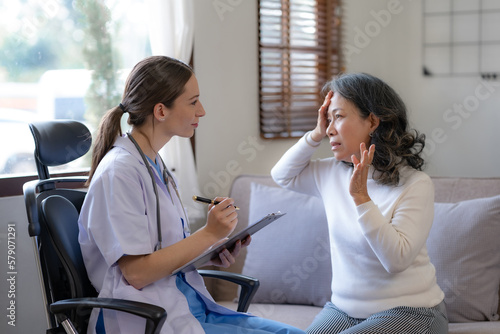 Doctor is checking the patient's history and detail about the patient's condition.