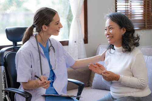 Doctor is checking the patient's history and detail about the patient's condition.