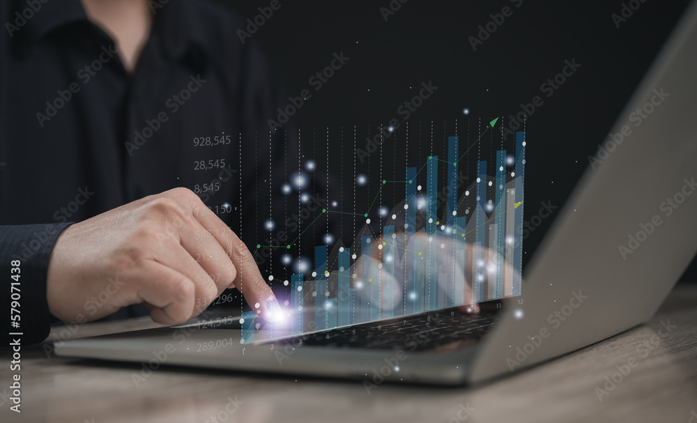 Fototapeta premium Businessman using Laptop for analytics and data management to study database corporate strategy for finance operation sales marketing 