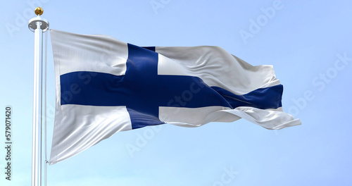 The national flag of Finland waving in the wind on a clear day.