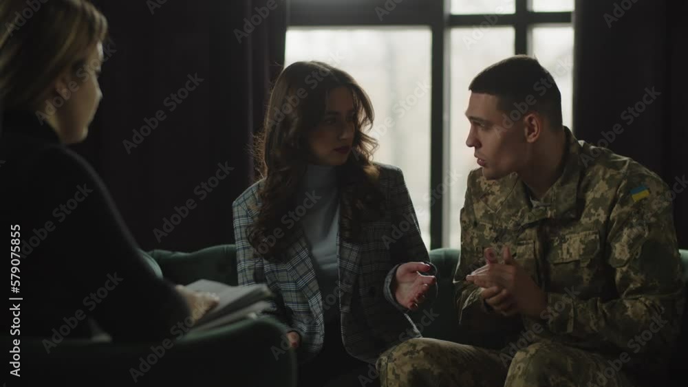 A woman tries to push her husband, who was at the front, to share his negative memories with a military psychologist. A member of the Ukrainian Armed Forces is having difficulty communicating with a A woman tries to push her husband, who was at the front, to share his negative memories with a military psychologist. A member of the Ukrainian Armed Forces is having difficulty communicating with a