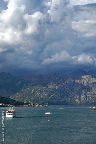 The entrance to the Bay of Kotor, Montenegro with dramatic storm clouds gathering over the mountains