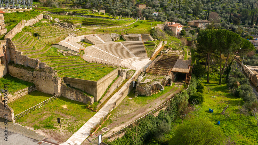 Aerial view of the ancient remains of a Roman theater. The archaeological site is located in Tivoli, near Rome, Italy.