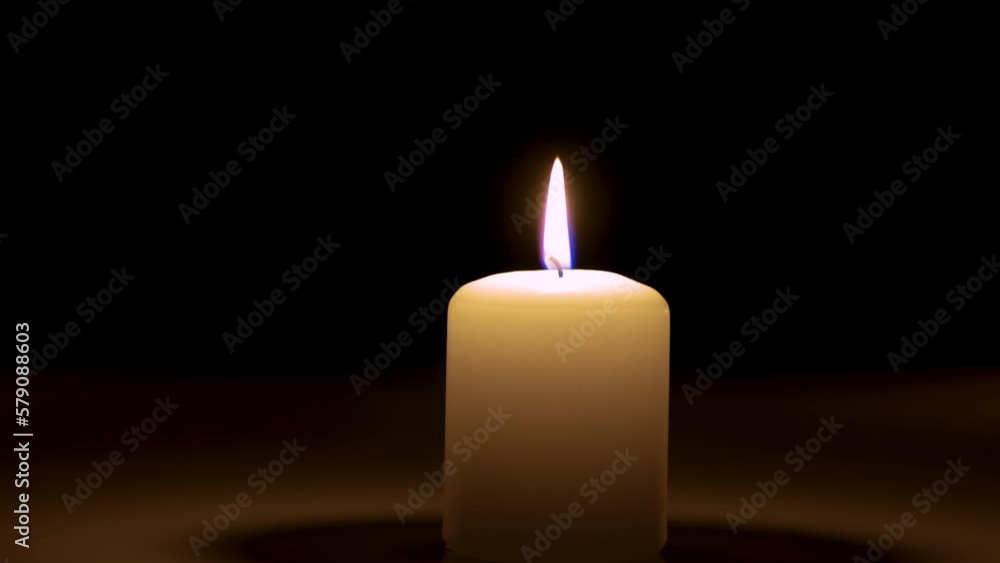 Candle flame. Candlelight burns with soft yellow flame. Lifestyle remembrance celebration religious Candle flame. Candlelight burns with soft yellow flame. Lifestyle remembrance celebration religious