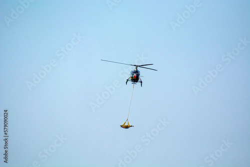 Helicopter rescue human utensils from affected area.