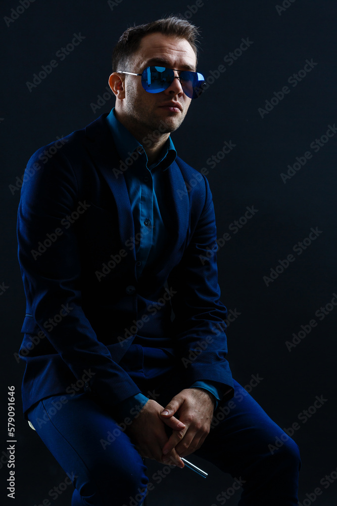 businessmen modern style suit fashion sunglasses dark background. businessmen modern style suit fashion sunglasses dark background.