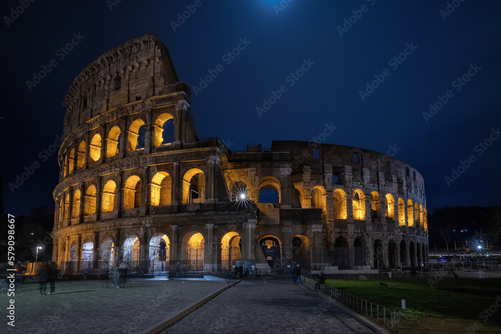 Illuminated Colosseum at night, long exposure.