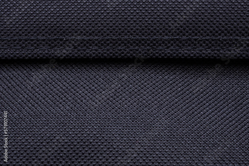 Black fabric texture pattern with stitch background