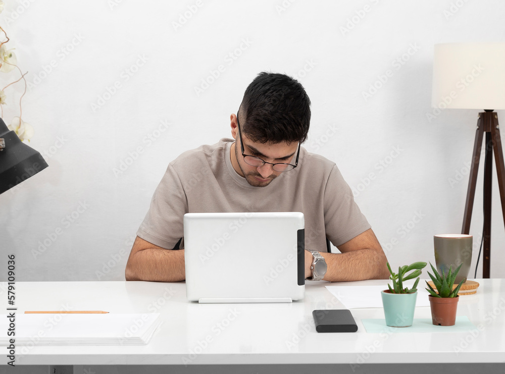 Young man working in home office.education.business.e-commerce