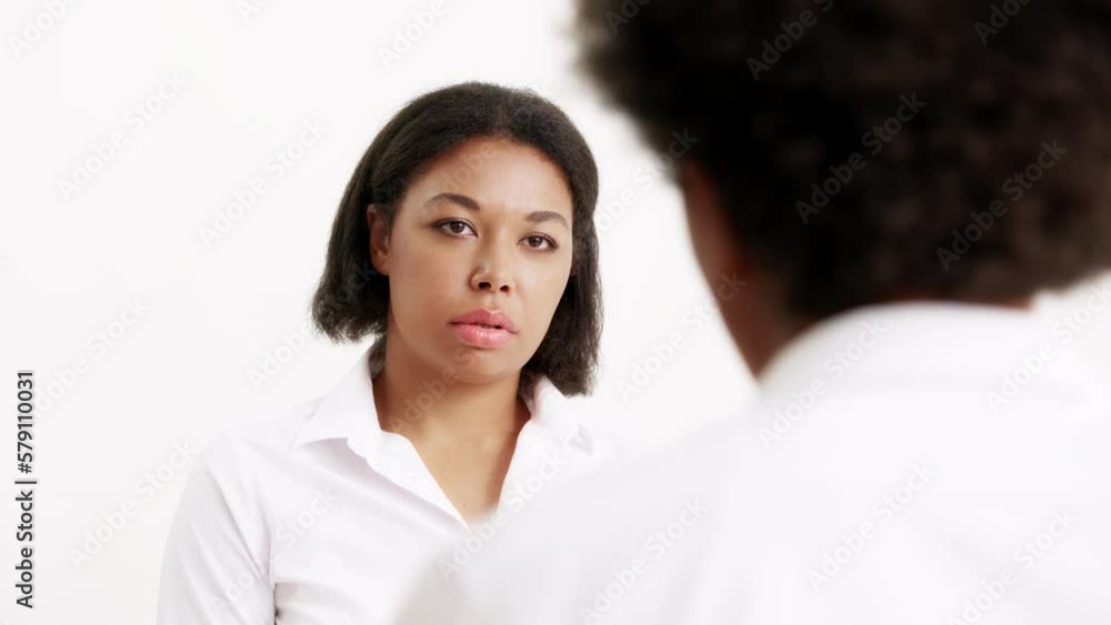 Young upset woman sharing her problems with virtual doctor, futuristic set Young upset woman sharing her problems with virtual doctor, futuristic set