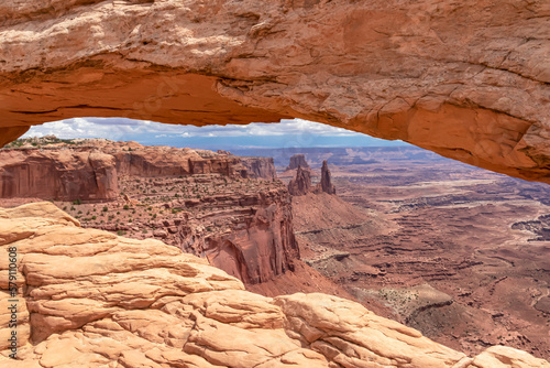 Scenic view through Mesa Arch near Moab, Canyonlands National Park, San Juan County, Southern Utah, USA. Looking at natural pothole arch rock formation on the eastern edge of Island in the Sky Mesa © Chris
