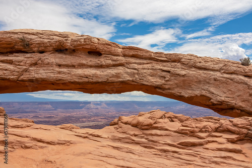 Scenic view through Mesa Arch near Moab  Canyonlands National Park  San Juan County  Southern Utah  USA. Looking at natural pothole arch rock formation on the eastern edge of Island in the Sky Mesa