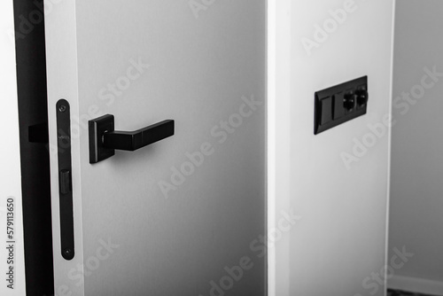 Minimalistic gray interior door with black door handle