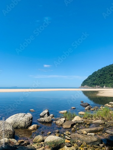 landscape with river and sky and blue sea