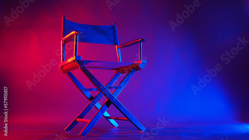 Black Director chair in red and blue light color with black background