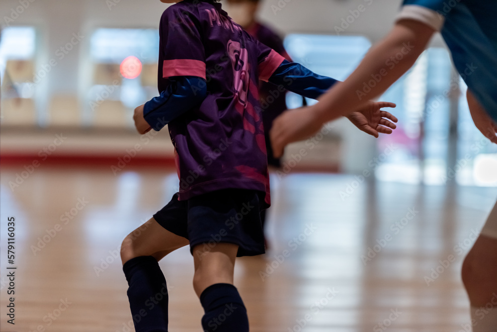 Fototapeta premium a player escapes her opponent's dribble